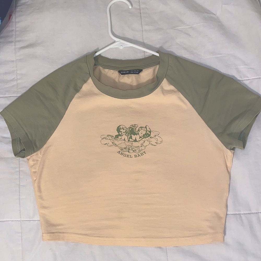 green and white “angel baby” crop top